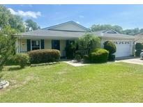 Charming single-story home with well-manicured lawn and mature landscaping at 4074 Parkway Blvd, Land O Lakes, FL 34639