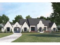 A charming single-story home boasts white brick, elegant archways, dark shutters, and a meticulously manicured lawn at 511 Avonwood, Tampa, FL 33625