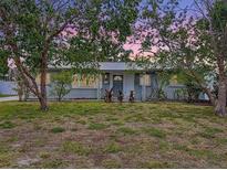 Charming single-story home with mature trees in the front yard and a welcoming front entrance at 6268 39Th N Ave, St Petersburg, FL 33709