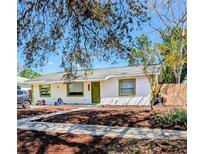 Charming one story home with a white exterior and a well manicured lawn at 6325 9Th S Ave, Gulfport, FL 33707