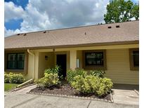 Cozy single story home with a lovely landscaped yard and warm neutral tones offers a welcoming curb appeal at 2567 Oakleaf Ln # 41B, Clearwater, FL 33763