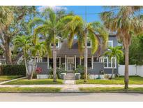 Charming two-story home with palm trees, walkway and nicely landscaped yard at 336 9Th Ne Ave, St Petersburg, FL 33701
