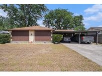 Single-story home featuring a carport and simple landscaping at 616 Highview S Cir, Brandon, FL 33510
