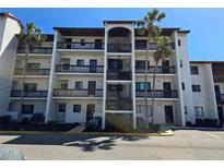 Beautiful condo with multiple stories, balconies, mature landscaping, and ample parking at 1624 Stickney Point Rd # 24-101, Sarasota, FL 34231