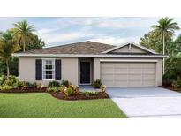 Charming single-story home with well-manicured lawn and a two-car garage at 7724 Wheat Stone Dr, Zephyrhills, FL 33540