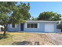 Charming one-story home with a well-maintained lawn and attached garage offering comfort at 5660 86Th Ave, Pinellas Park, FL 33782