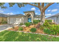 Charming single-story home featuring a well-manicured lawn and lush landscaping at 1639 Wakefield Dr, Brandon, FL 33511