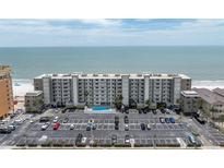 An attractive condo building with a pool and plenty of parking, located directly on the beach at 18650 Gulf Blvd # 203, Indian Shores, FL 33785