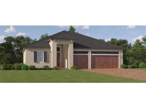 Charming single-Gathering home showcasing neutral stucco, complemented by a brick driveway and a two-car garage at 31597 Cardinal Yard Dr, San Antonio, FL 33576