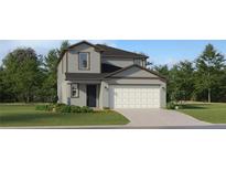 Charming two-story home with a well-maintained lawn, attached two-car garage, and traditional architectural style at 2288 Blue Grosbeak Pl, Wimauma, FL 33598
