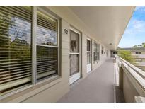 Inviting condo entrance with natural light streaming through the window at 2426 Persian Dr # 52, Clearwater, FL 33763
