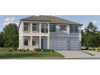 Charming two-story home featuring a balcony, neutral colors, well-manicured lawn, and an attached two car garage at 6909 E 116Th Ct, Palmetto, FL 34221
