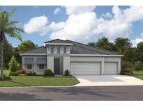 Charming single-story home featuring a three-car garage, gray color palette, and a beautifully landscaped front yard at 10321 Surrey Rose Dr, San Antonio, FL 33576