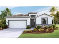 Charming one-story home featuring a two-car garage, neutral paint and beautifully landscaped front yard at 19720 Gladeview Way, Land O Lakes, FL 34638