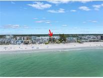 Stunning aerial view of beachfront condo with pristine beach and Gulf of Mexico access at 19910 Gulf Boulevard # 102, Indian Shores, FL 33785