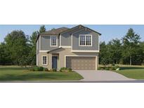 Two-story home featuring a two-car garage, neutral color palette, landscaping and manicured lawn at 8449 Sea Ray Run, Parrish, FL 34219
