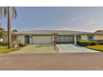 Charming single story home with a well-manicured lawn and two-car garage at 2115 N Halcyon Dr # 510, Sun City Center, FL 33573