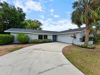 Charming single-story home featuring a curved driveway and a beautiful blue front door at 3508 Yale Cir, Riverview, FL 33578
