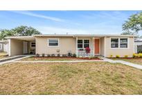 Charming single-story home with tidy landscaping and a cozy, covered entrance at 6816 13Th N St, St Petersburg, FL 33702