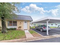 Charming single-story home with a covered carport and well-maintained front lawn at 11723 Boynton Ln # 1, New Port Richey, FL 34654