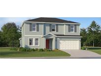 Charming two-story home with a well-manicured lawn and attached garage, offers delightful curb appeal at 15042 Zircon Red Dr, Wimauma, FL 33598