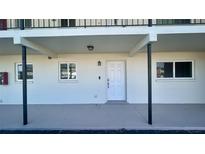 Exterior entrance showcasing the front door, white exterior, and covered entryway at 4570 Overlook Ne Dr # 180, St Petersburg, FL 33703