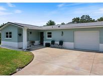 Charming single-story home with a two-toned exterior and well-maintained lawn, perfect for curb appeal at 460 4Th S St, Safety Harbor, FL 34695