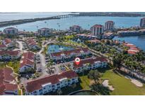Panoramic aerial view featuring water, bridge, and community with ponds and parking at 6085 Bahia Del Mar Blvd # 106, St Petersburg, FL 33715