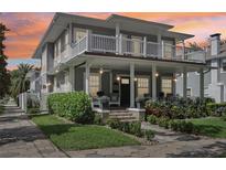 Charming two-story home with a beautiful landscaped yard and inviting front porch and balcony at 157 9Th N Ave, St Petersburg, FL 33701