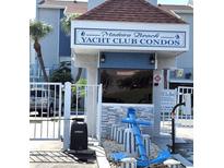 Community entrance to the Madeira Beach Yacht Club Condos, with an anchor and gate at 323 Rex Pl # G, Madeira Beach, FL 33708