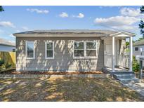 Charming single-story home featuring a cozy front porch and well-maintained landscaping at 3535 16Th N St, St Petersburg, FL 33704