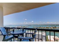 Relax on this balcony offering seating with table and stunning views of the ocean and waterfront neighborhood at 400 Island Way # 1709, Clearwater Beach, FL 33767