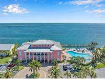 Breathtaking waterfront home featuring a gorgeous pool, lush landscaping, and a private dock for a boat at 4872 Beach Se Dr # D, St Petersburg, FL 33705