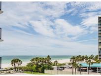 Expansive beach view from a beachfront condo highlighting the beautiful scenery at 1400 Gulf Blvd # 306, Clearwater Beach, FL 33767