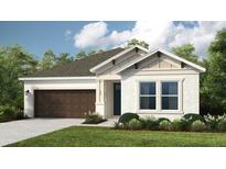 Charming single-story home with a well-manicured lawn, neutral paint, and a two-car garage at 33284 Castaway Loop, Wesley Chapel, FL 33543