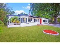 Charming single story home featuring a well-manicured lawn, and attractive curb appeal at 1111 Briarwood Rd, Brandon, FL 33511