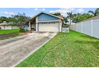 Charming single-Gathering home with a two-car garage and well-manicured lawn at 12125 71St Way, Largo, FL 33773