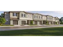 Beautiful townhome exterior with attached garages, neutral color scheme, and well-maintained landscaping at 11114 E 65Th Ter, Palmetto, FL 34221