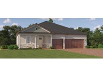 Charming single-story home with stone accents, a two-car garage, and a well-manicured lawn in a desirable community at 16983 Falling Waters Ct, Land O Lakes, FL 34638