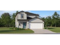 Charming two-story home with a blue front door, a two-car garage, and professionally landscaped front yard at 2274 Blue Grosbeak Pl, Wimauma, FL 33598