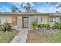 Charming single story home featuring well-manicured landscaping and a welcoming entrance at 2696 60Th Avenue W Ter # 10, Bradenton, FL 34207