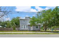 Charming two-story home features a neutral exterior, white trim, and welcoming curb appeal at 2700 10Th W St, Palmetto, FL 34221