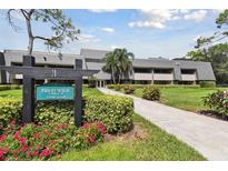 Prestwick Lodge 20 featuring lush landscaping and a well-maintained exterior at 36750 Us 19 N Hwy # 3104, Palm Harbor, FL 34684
