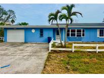 Charming single-story home with a well-maintained yard and a one car garage at 17595 1St E St, Redington Shores, FL 33708