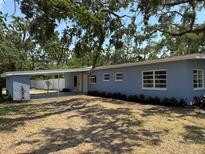 Charming single-story home with a carport, freshly painted exterior, and well-maintained landscaping at 3000 58Th S Ave, St Petersburg, FL 33712