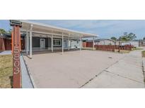Well-maintained single-story home with a spacious carport and manicured lawn at 5803 Cresthill Dr, Tampa, FL 33615