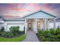 Charming single-story home featuring a welcoming front porch and attached two-car garage at 7614 Addison Ave, Bradenton, FL 34210