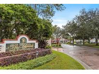The Highlands Condominium Residences entrance sign with landscaping and a view of the community at 9481 Highland Oak Dr # 710, Tampa, FL 33647