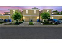 Two-story townhomes featuring attached garages, manicured lawns, and inviting curb appeal at 2234 Lennox Dale Ln, Brandon, FL 33510