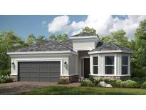 Charming single-story home features a two-car garage, a welcoming entryway and beautiful landscaping at 29807 Imperati Blvd, Wesley Chapel, FL 33543